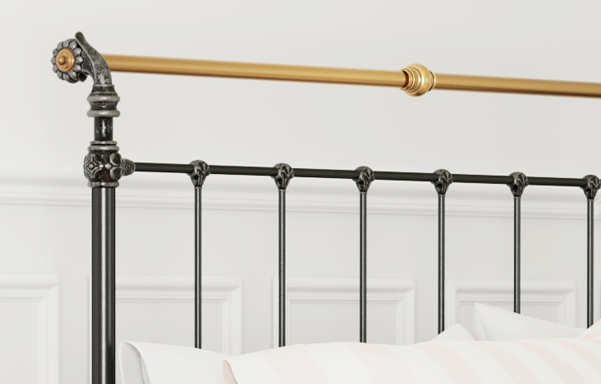 Iron & Brass Bed headboard close-up in black iron and silver with antique brass
