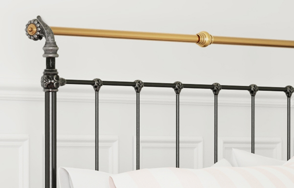 Iron & Brass Bed headboard close-up in black iron and silver with antique brass